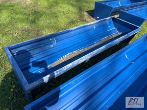 lot 29 image: 90in steel feeding trough. MDI Item is locat...