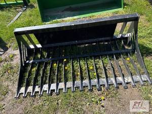 lot 105 image: 68in rock bucket for skid loader. MDI Item i...