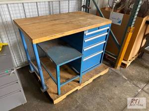 lot 84 image: Industrial workbench with wooden top and cabi...