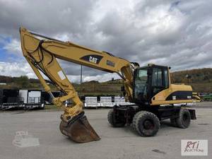 lot 11 image: 2004 Cat M322C rubber tired excavat...