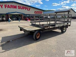 lot 129 image: Running gear and wooden flat wagon ...