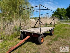 lot 138 image: 12ft hay wagon. Solid deck and running gear. ...
