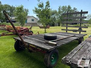 lot 143 image: Home built wagon. Wood deck. Includes drawbar...