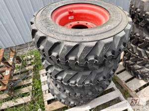 lot 54 image: Waterloo- (4) Kubota 10-16.5 skid steer rims ...
