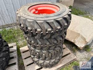 lot 55 image: Waterloo- (4) Kubota 10x16.5 skid steer rims ...