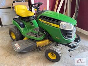 lot 145 image: John Deere E110 riding lawn mower. ...