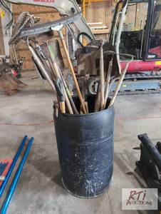 lot 53 image: Barrel of shovels and rakes...