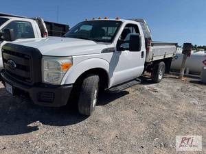 lot 3 image: 2011 Ford F350 regular cab flatbed....