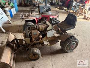 lot 81 image: Garden tractor with snowplow. The i...