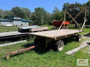 lot 102 image: Hay wagon. 16 ft x 7 ft. Mounted on...