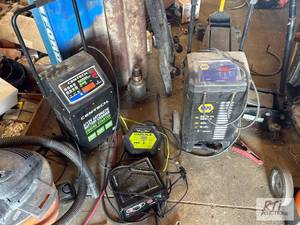 lot 144 image: (4) Battery chargers. Carlyle and C...