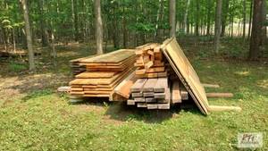 lot 152 image: Lot consisting of rough-cut lumber ...