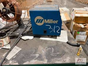 lot 312 image: Miller wire feeder and welder parts...