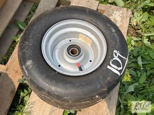 lot 109 image: 16x6.5-8 Tire and rim.&nbspLocated...