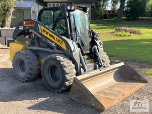 lot 78 image: New Holland L328 skid steer load...