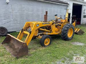lot 84 image: John Deere 300 Series backhoe loade...