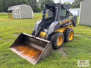 lot 63 image: 2001 New Holland LS150 skid steer. ...