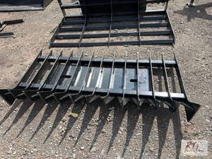 lot 182 image: 70in root rake for skid loader....
