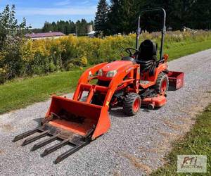 lot 93 image: 2017 Kubota BX2670 compact tractor....