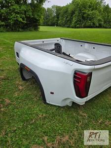 lot 148 image: 2023 GMC 3500 dually pickup box. Ta...