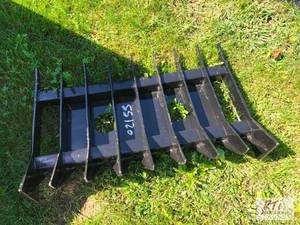 lot 152 image: 32in root rake for mini skid loader...