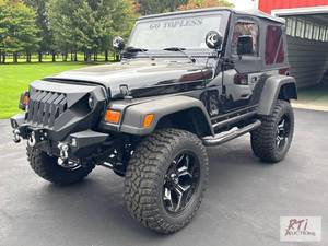 lot 37 image: 1999 Jeep Wrangler Sport. VIN 1J4F...
